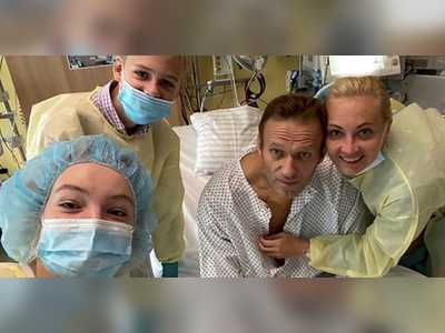 'Hi, this is Navalny': Poisoned Putin critic posts photo from hospital as his aide says he plans to return to Russia