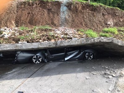 Collapsed wall crushes cars in Havers Estate