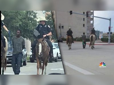 Black man led by mounted police while bound with a rope sues Texas city for $1 million