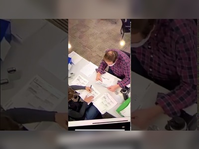 Woman inside polling area has been filling out BLANK BALLOTS for over an hour, and stamping them