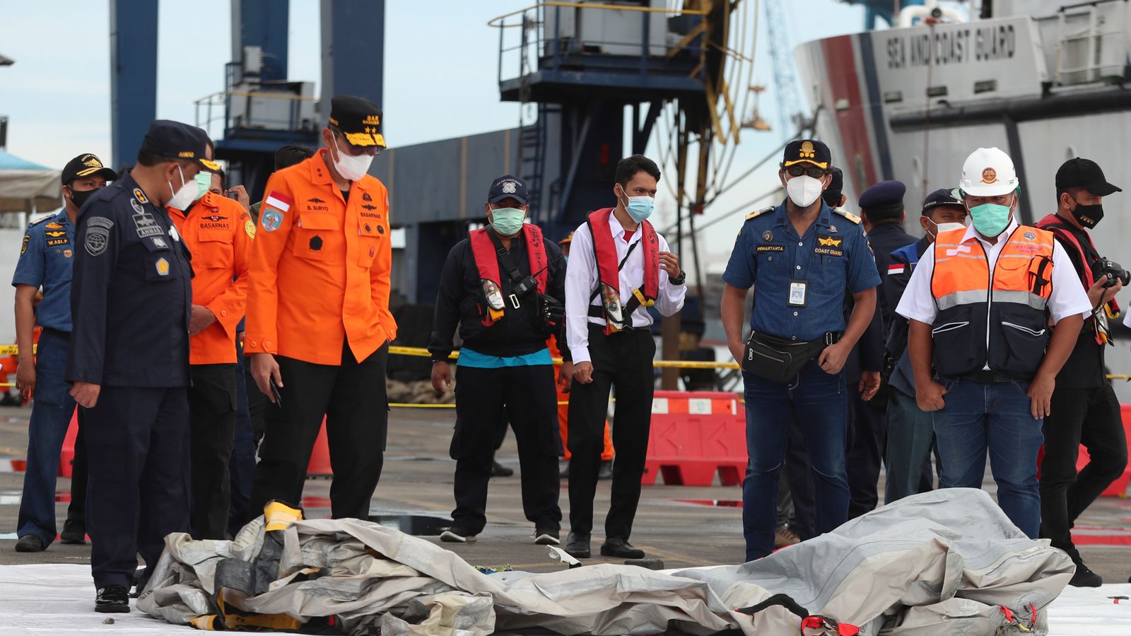 Indonesia plane crash: Divers discover body parts and pieces of fuselage after plane crash
