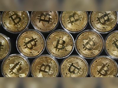 Bitcoin's market value tops $1 trillion