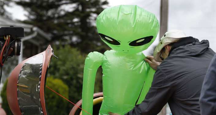 Aliens Don't Visit Earth as They're 'Smarter' & Not Attracted to Green Grass, Harvard Prof. Says