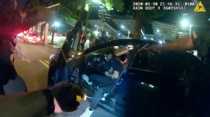 Firings overturned for 2 officers who tasered Black students