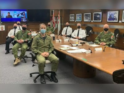 Canada military trumpets diversity … with picture of eight white men