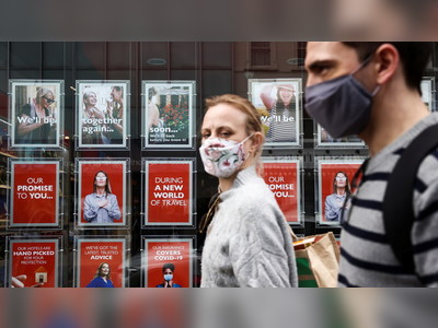 Masks and distancing could be required for several more YEARS, British public health expert says