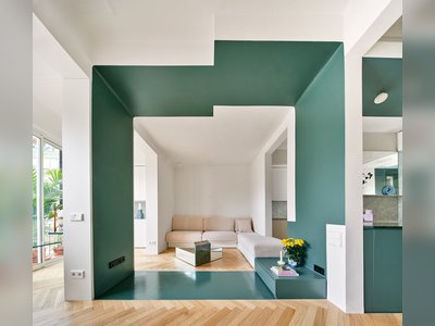  A 1920s Barcelona Flat Trades Confining Walls for a Green-Painted Partition