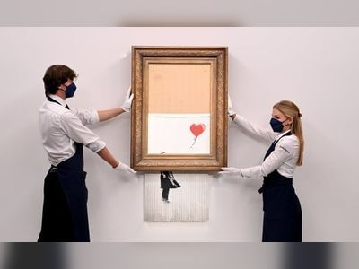 Banksy sets auction record with £18.5m sale of shredded painting