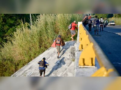 Migrants from 12 countries among 600 found in two trucks in Mexico