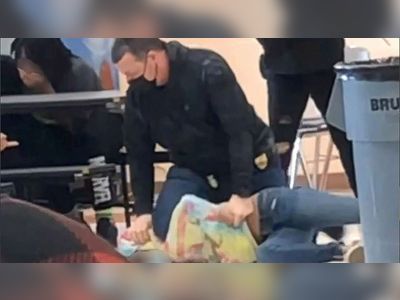 US officer appears to kneel on girl's neck
