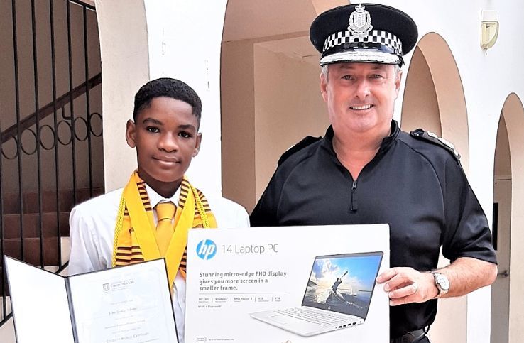 Police presents laptop to Ebenezer Thomas Primary top student